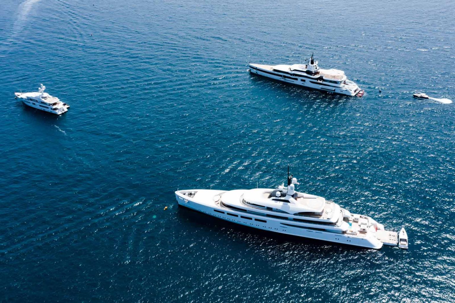 Luxury yacht cruising along the Spanish coast, showcasing top charter destinations from Costa Brava to southern Spain